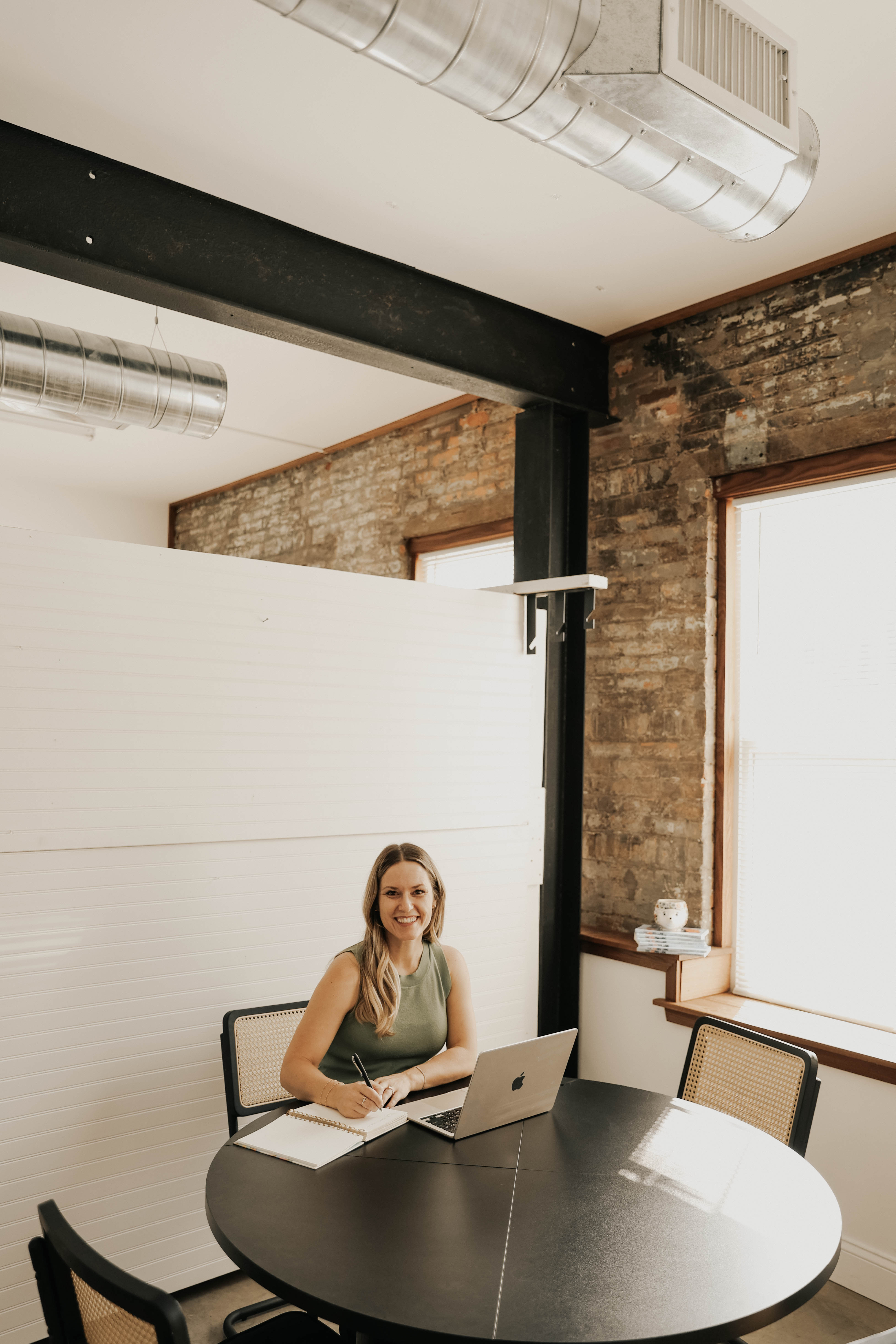 Dr. Gretchen Hawley smiling at her desk