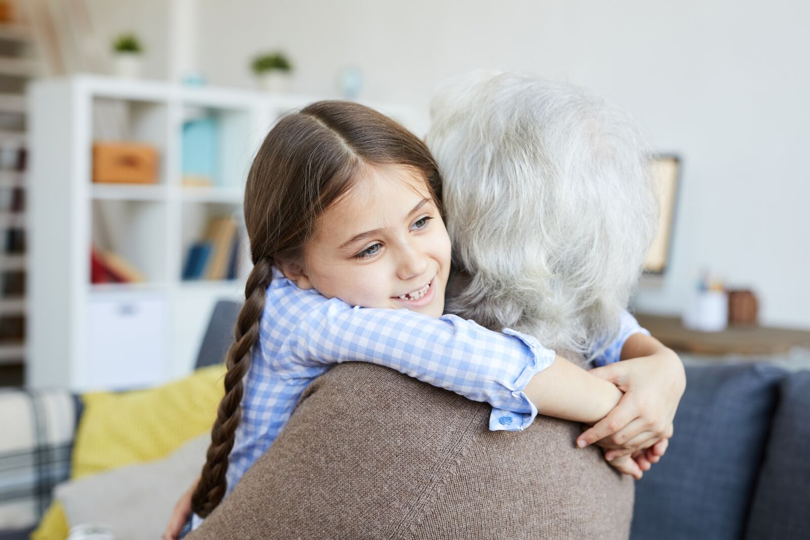 Girl embracing her grandmother – complex lineage Canadian citizenship by descent claim with lawyer review