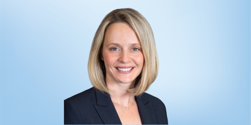 Dora Lendvai, research advisor for the Healing Touch Program, smiling against a light blue background.