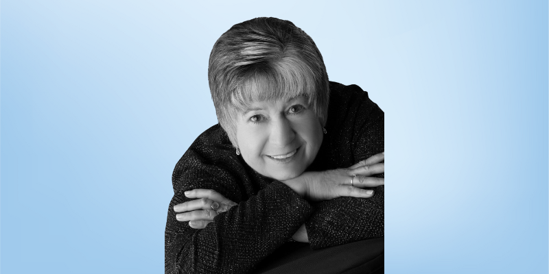 Jean Pruett, curriculum review board member for the Healing Touch Program, photographed in black and white against a light blue background.