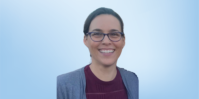 Jennifer Lane, class manager at the Healing Touch Program, smiling against a light blue background.