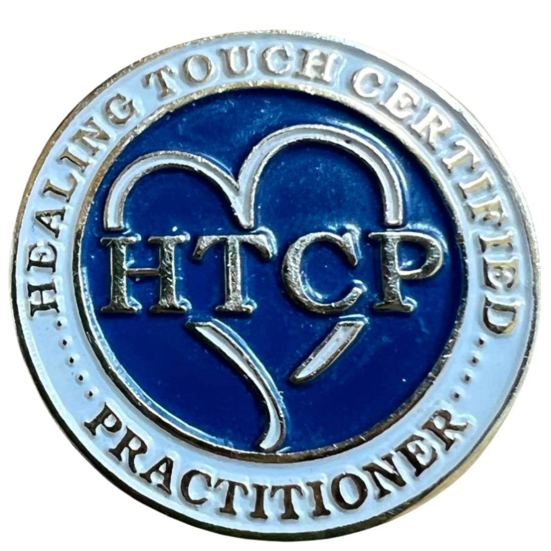 Healing Touch Certified Practitioner (HTCP) certification pin representing completion of professional Healing Touch training and independent certification.