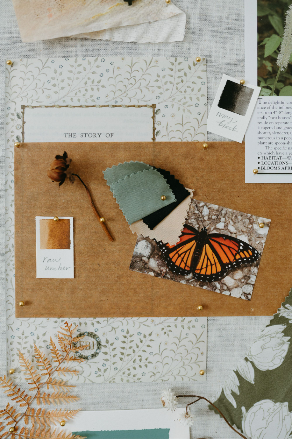 Printed cards and stationery on a pin board