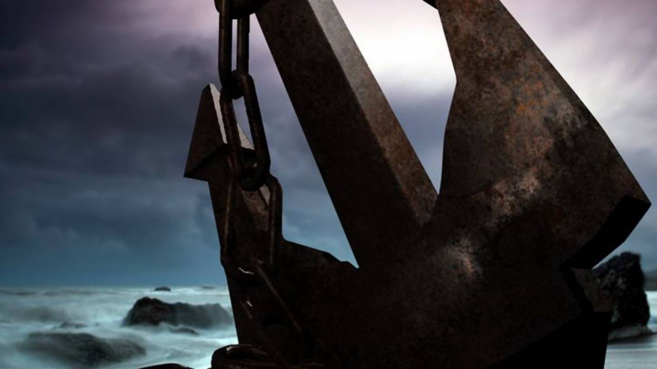 Large anchor resting in stormy waters