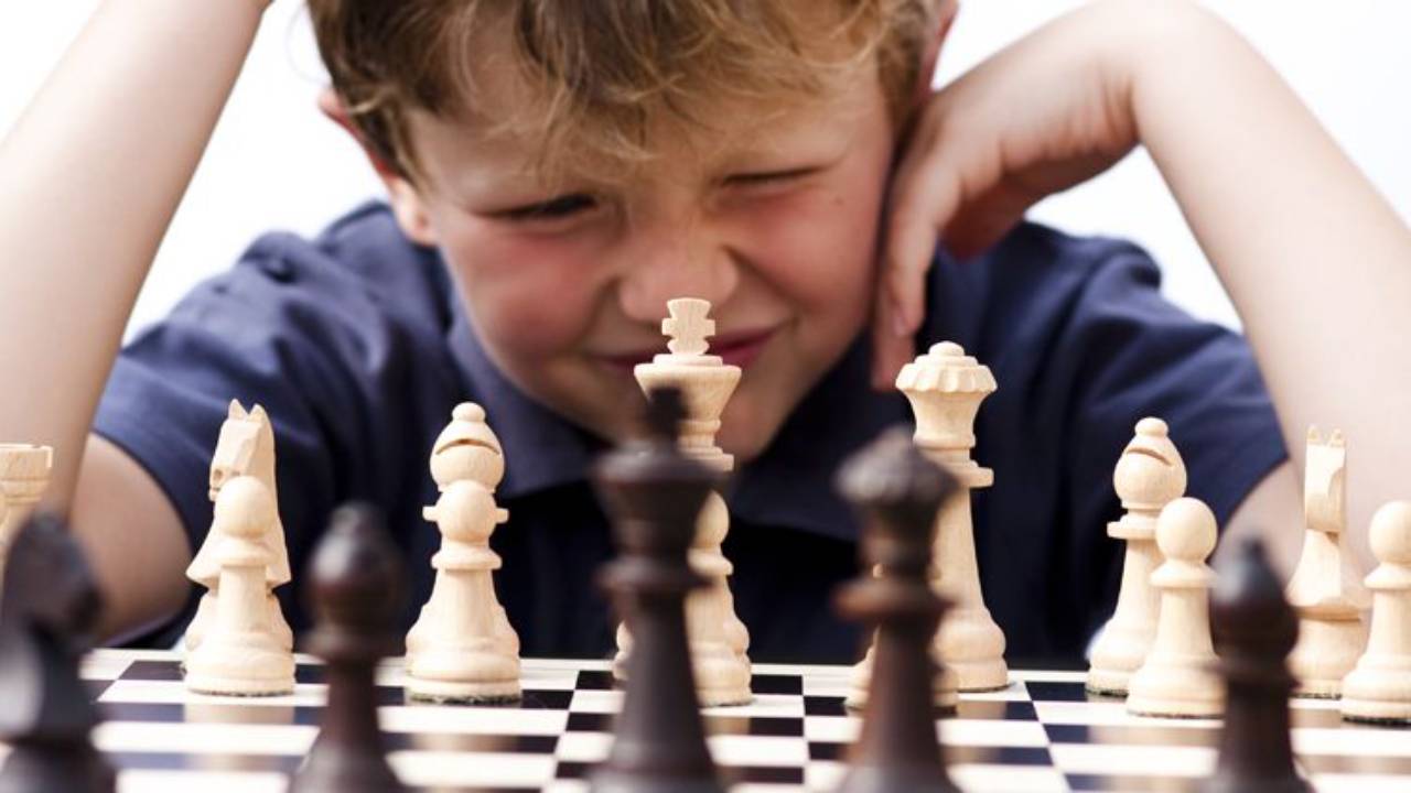 Frustrated kid playing chess