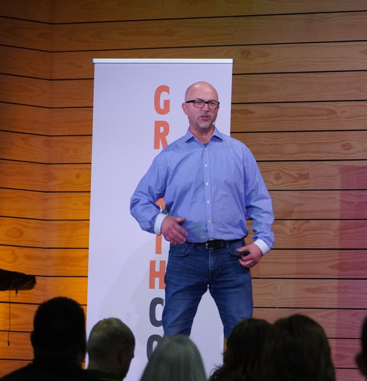 Jody Holland speaking to a room of leaders