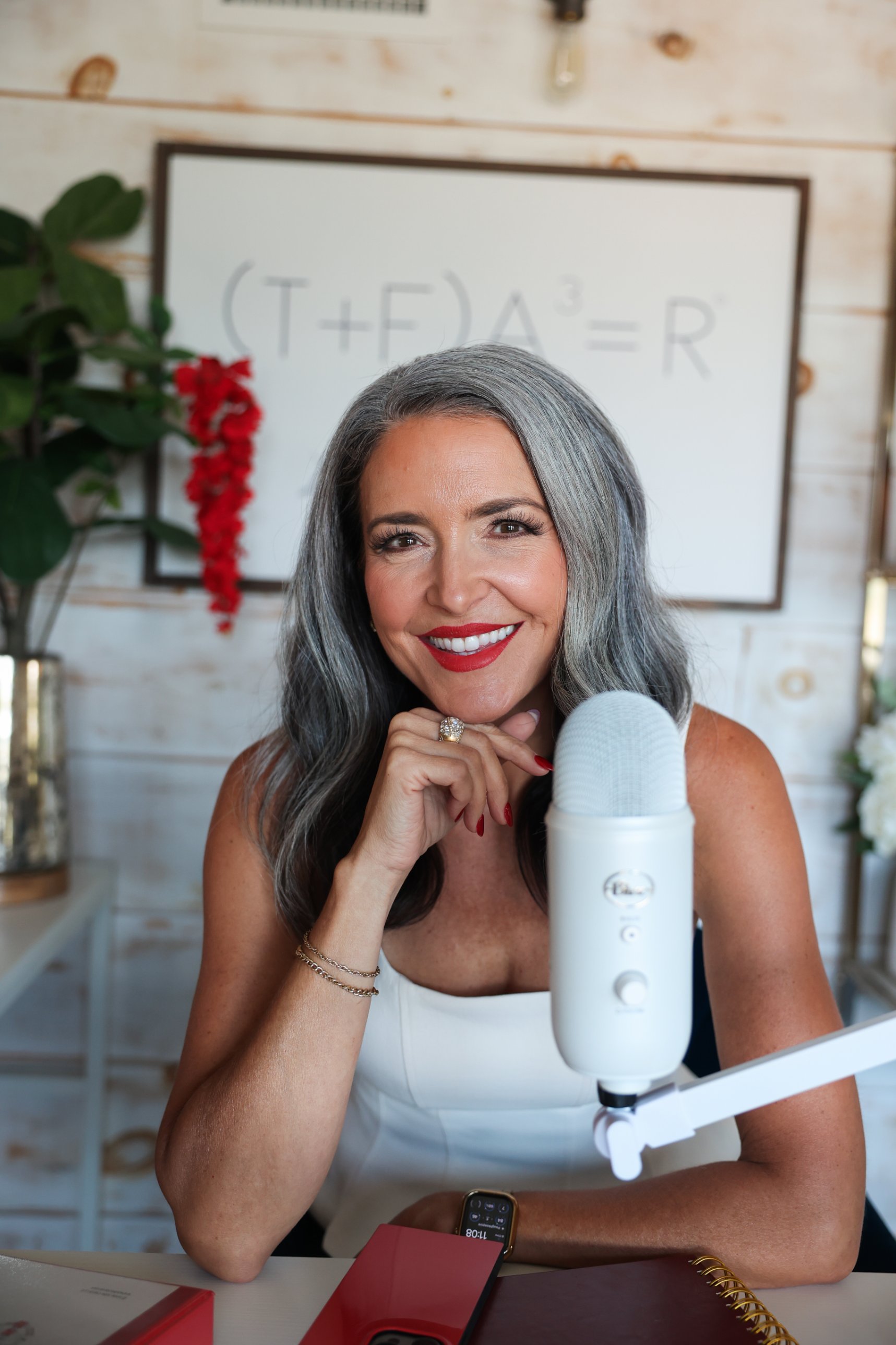 Julie Ciardi at her desk in front of the formula