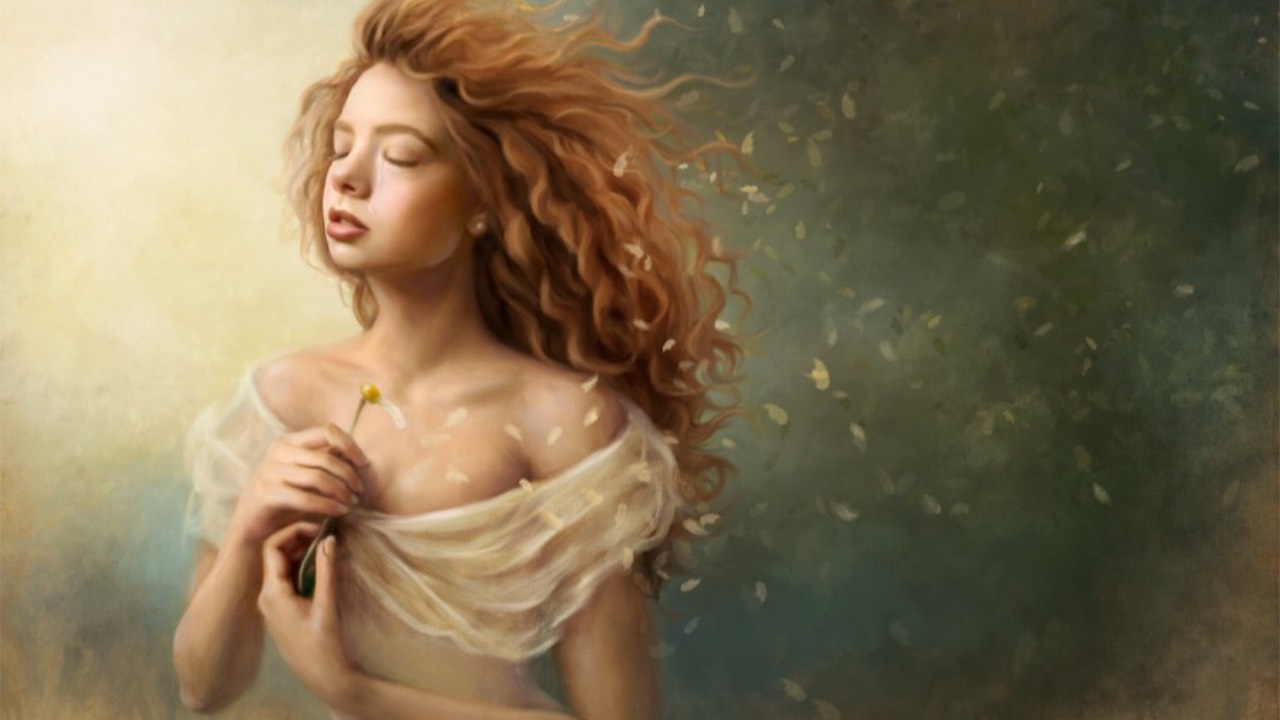 Girl holding flower in wind