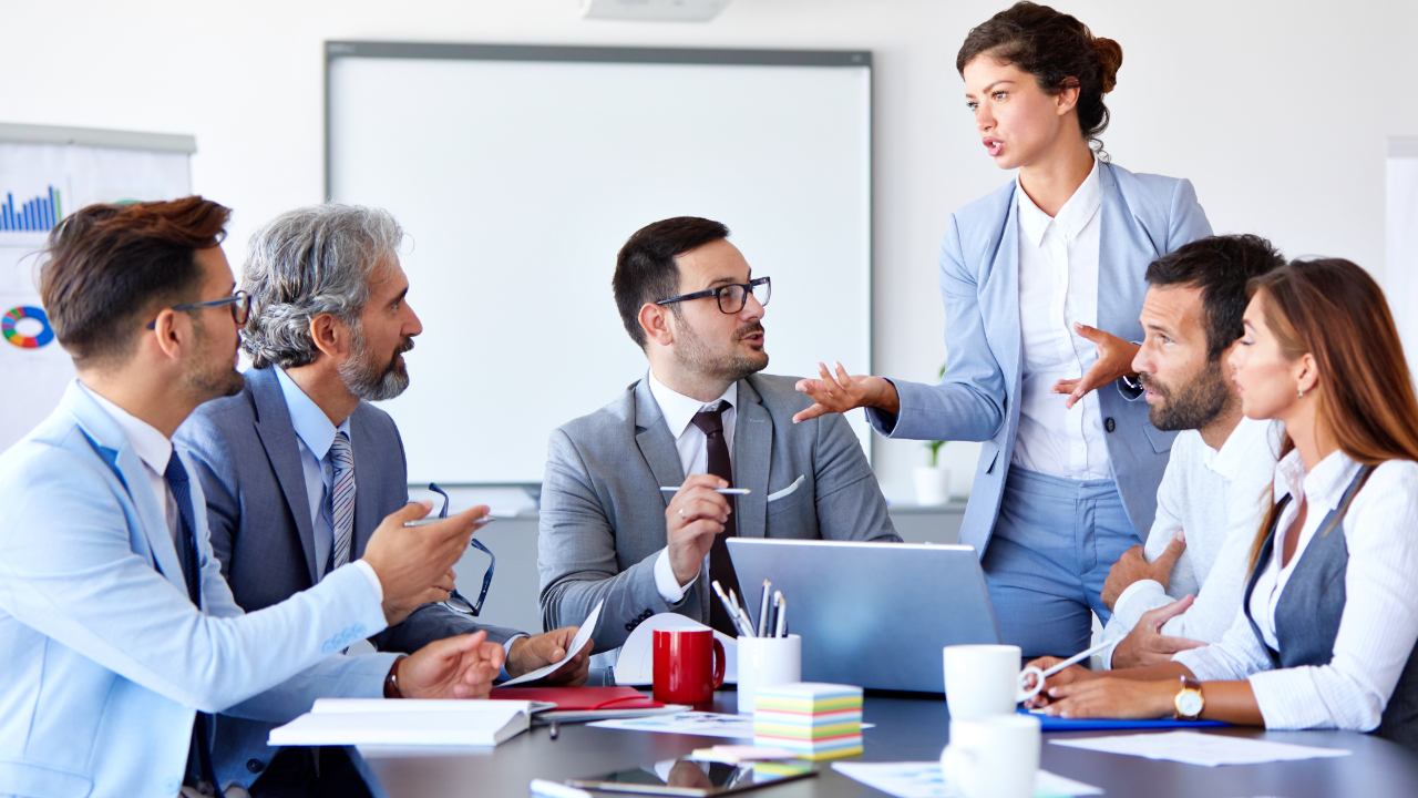 Executive coach in Tampa teaching emotional intelligence and leadership development during a team discussion