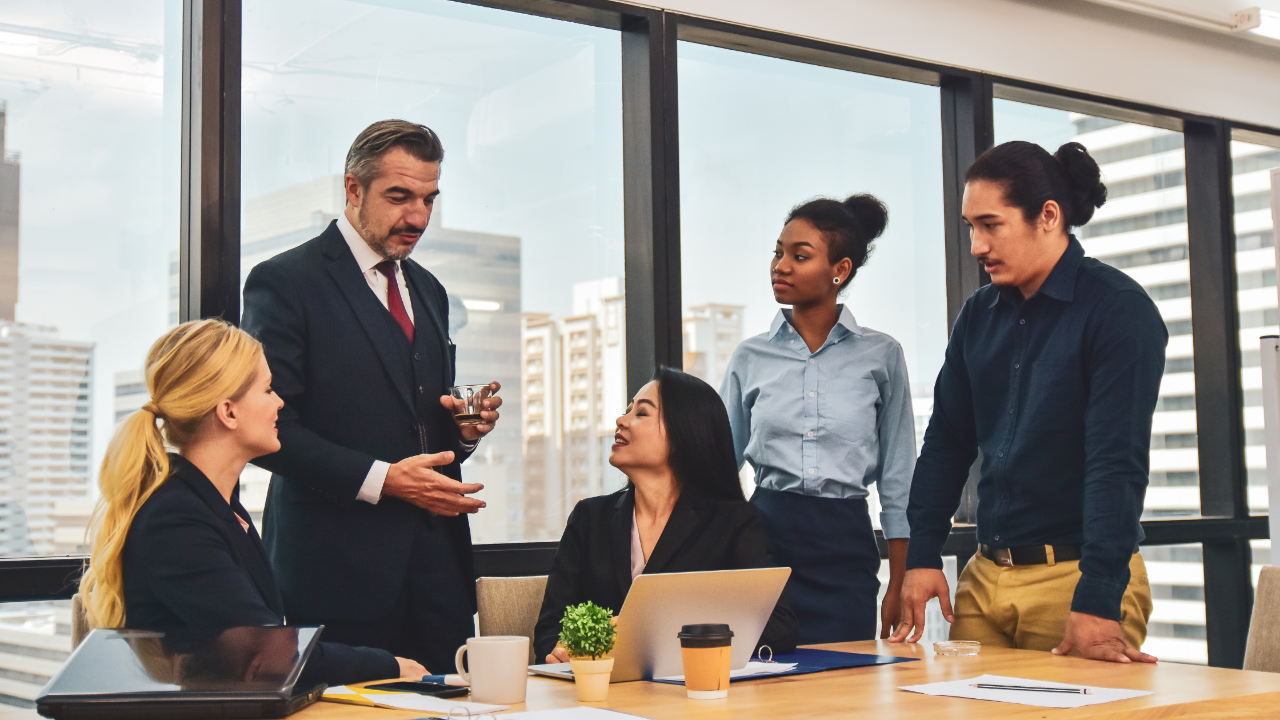 Executive coach in Tampa teaching leadership credibility, emotional intelligence, conflict resolution, and executive presence during a leadership training session.