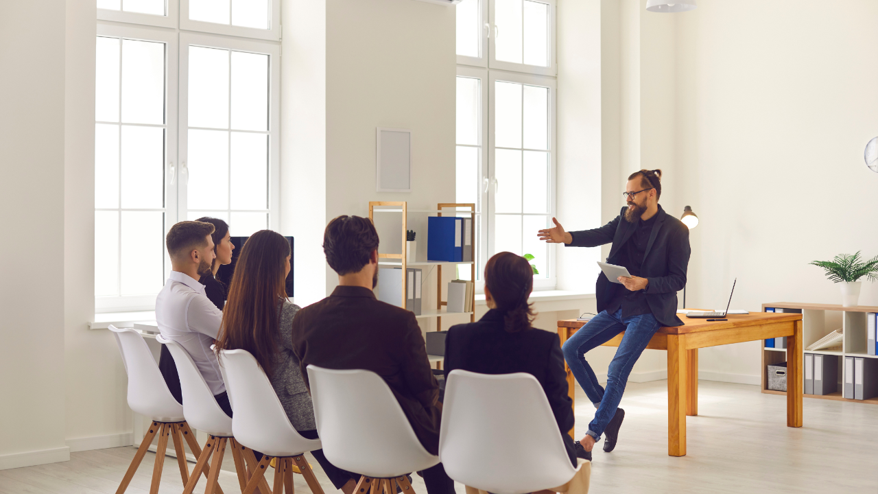 Executive coach in Tampa teaching leadership development and daily habit formation during a leadership training session.