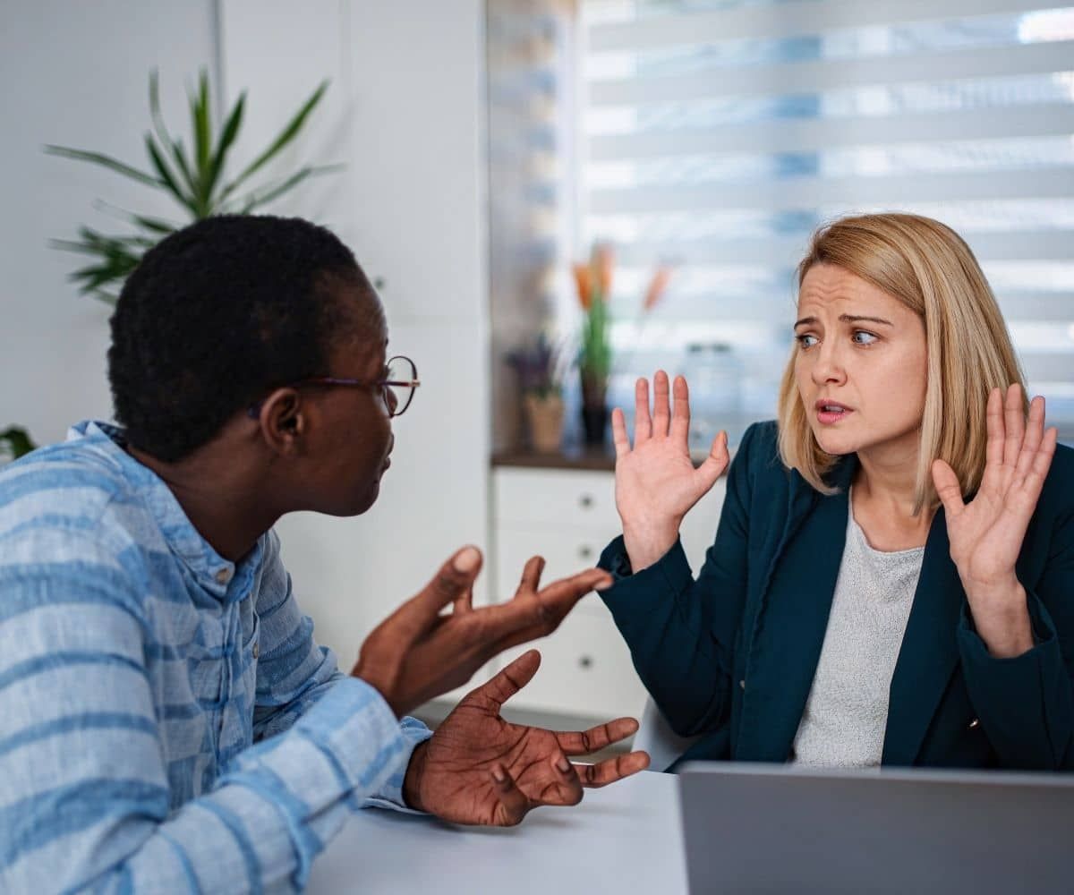 Two people in conversation showing different reactions and perspectives