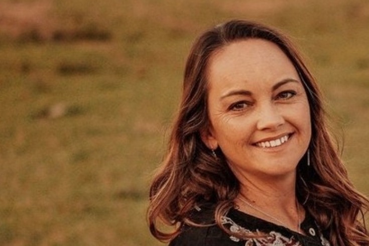 Amy Brown of Brown Tulip Ranch in a pasture