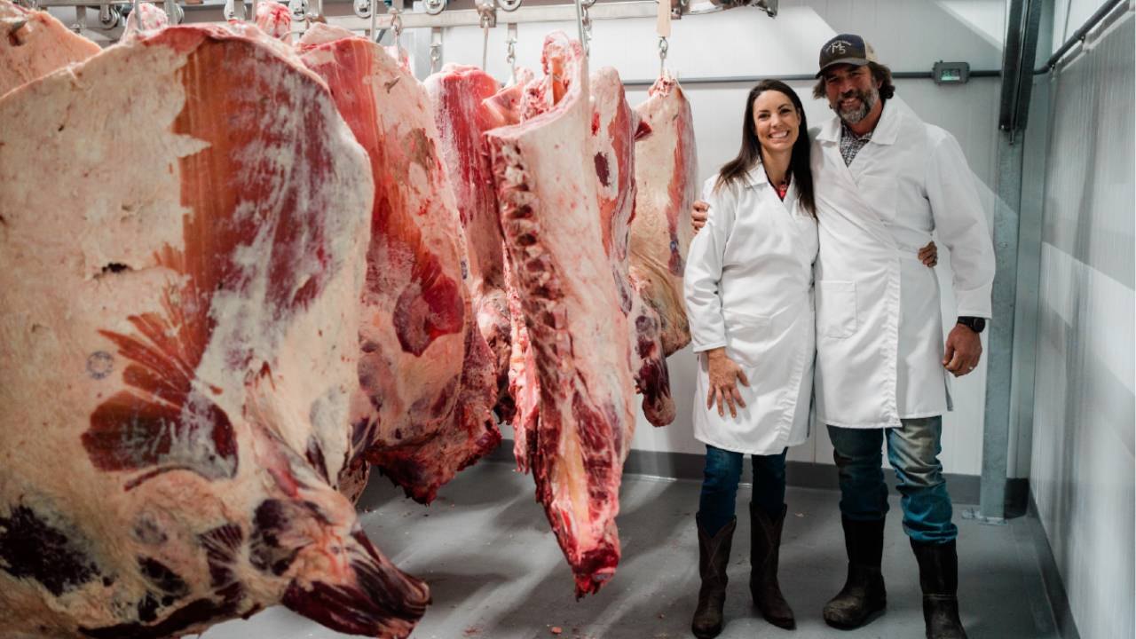 Mary and Brian Heffernan in white coats inside the Five Marys butchery
