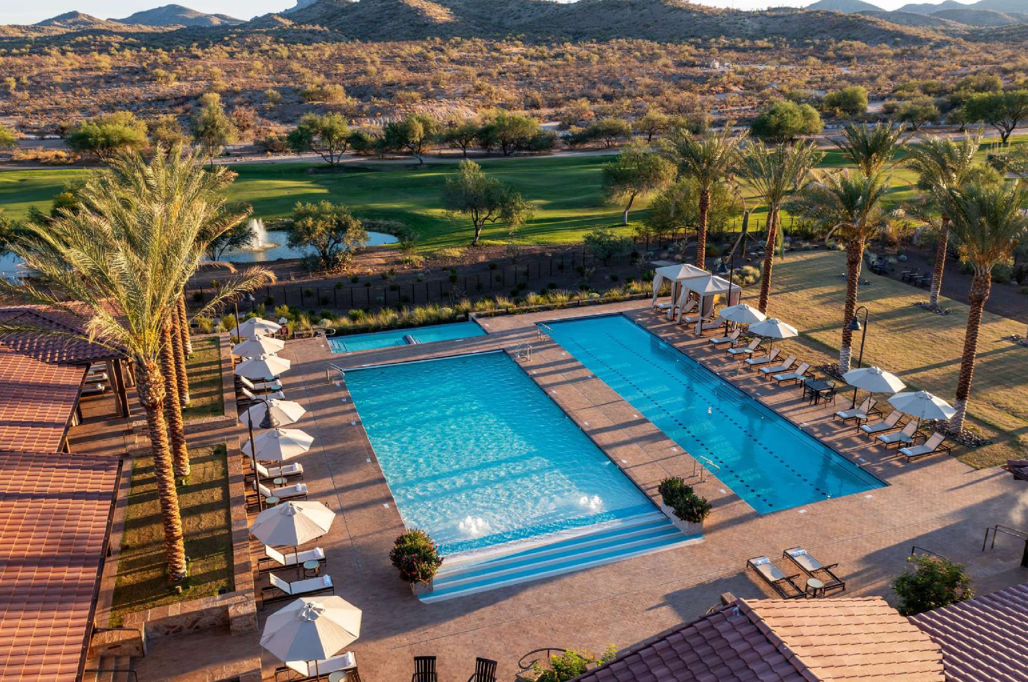 The pools at Rancho de los Caballeros with the Sonoran desert hills behind them