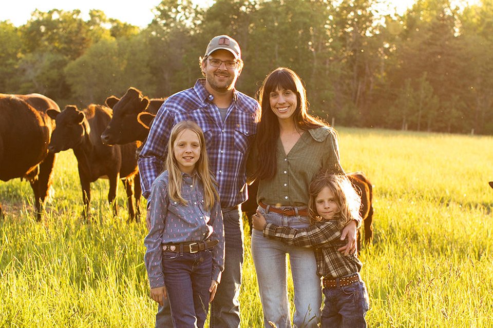 Ashley Turner and her family in the pasture at Turner Farm