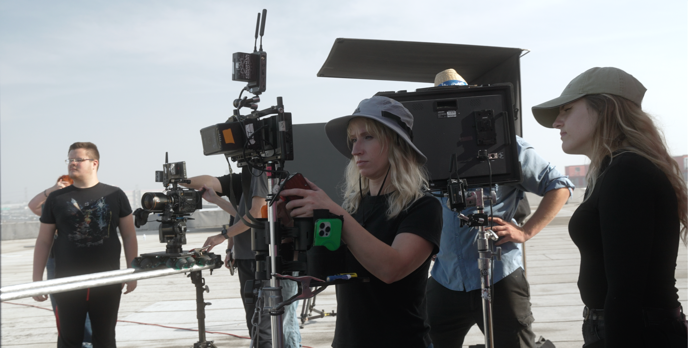 Creative HQ filmmakers working with cinema camera equipment