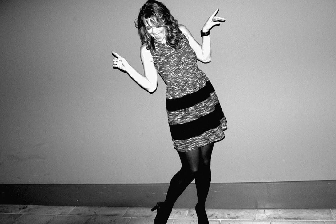 Alicia dancing, arms up