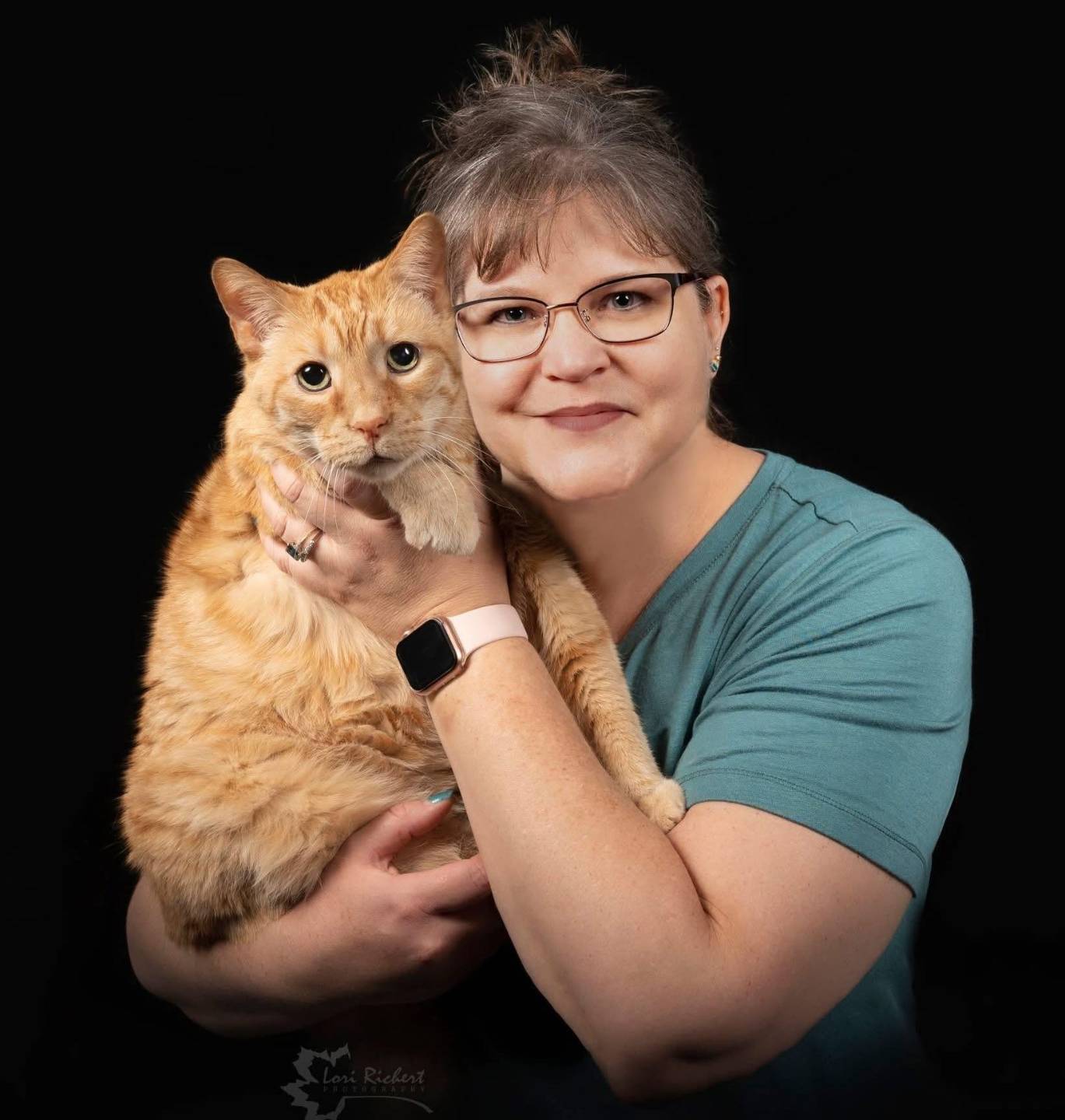 Denise, a Kate Brown Healing Essentials client, with her cat