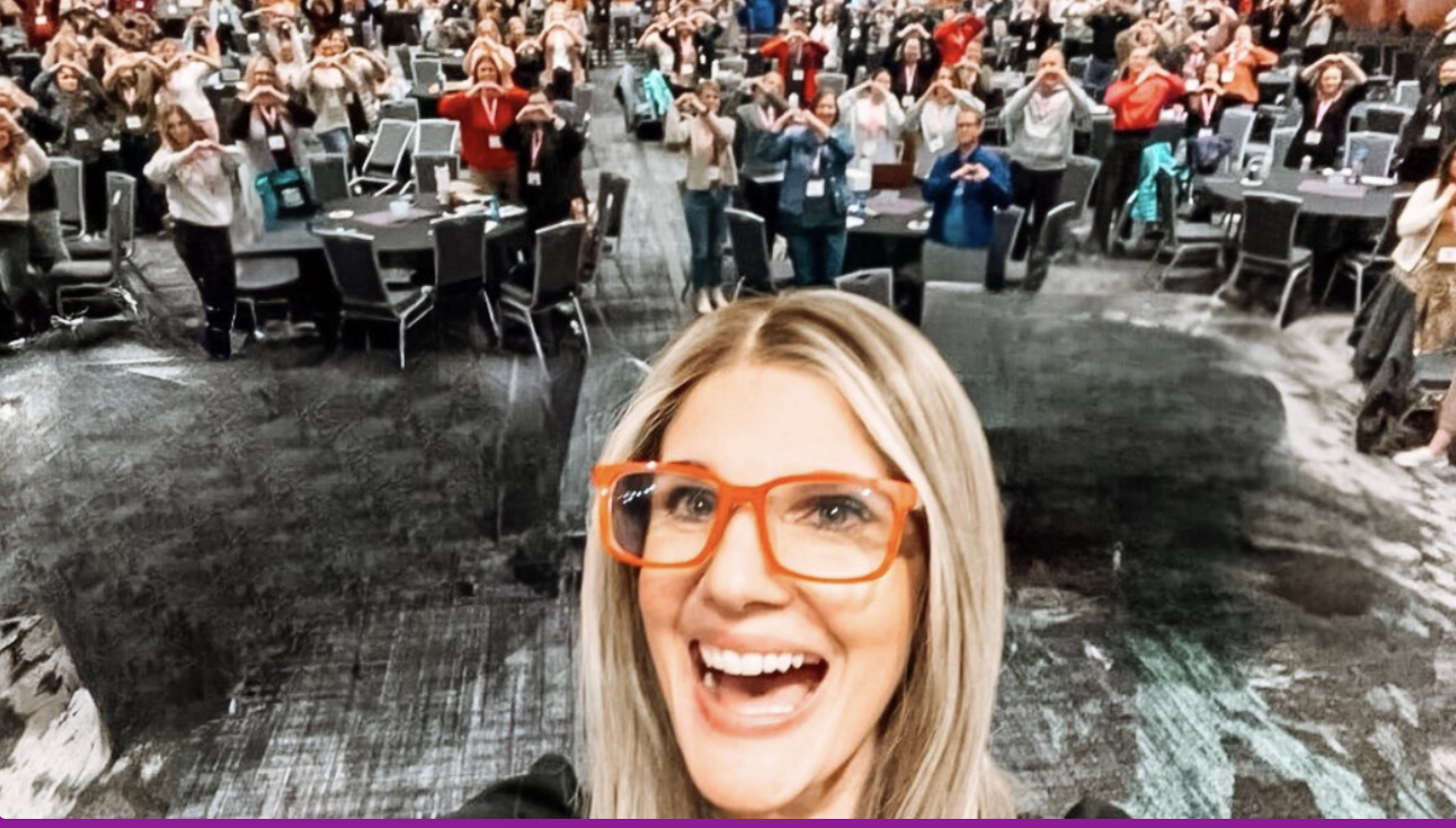 Lyndsay with a Utah school counselor audience behind her