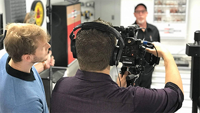 2 guys using a video camera