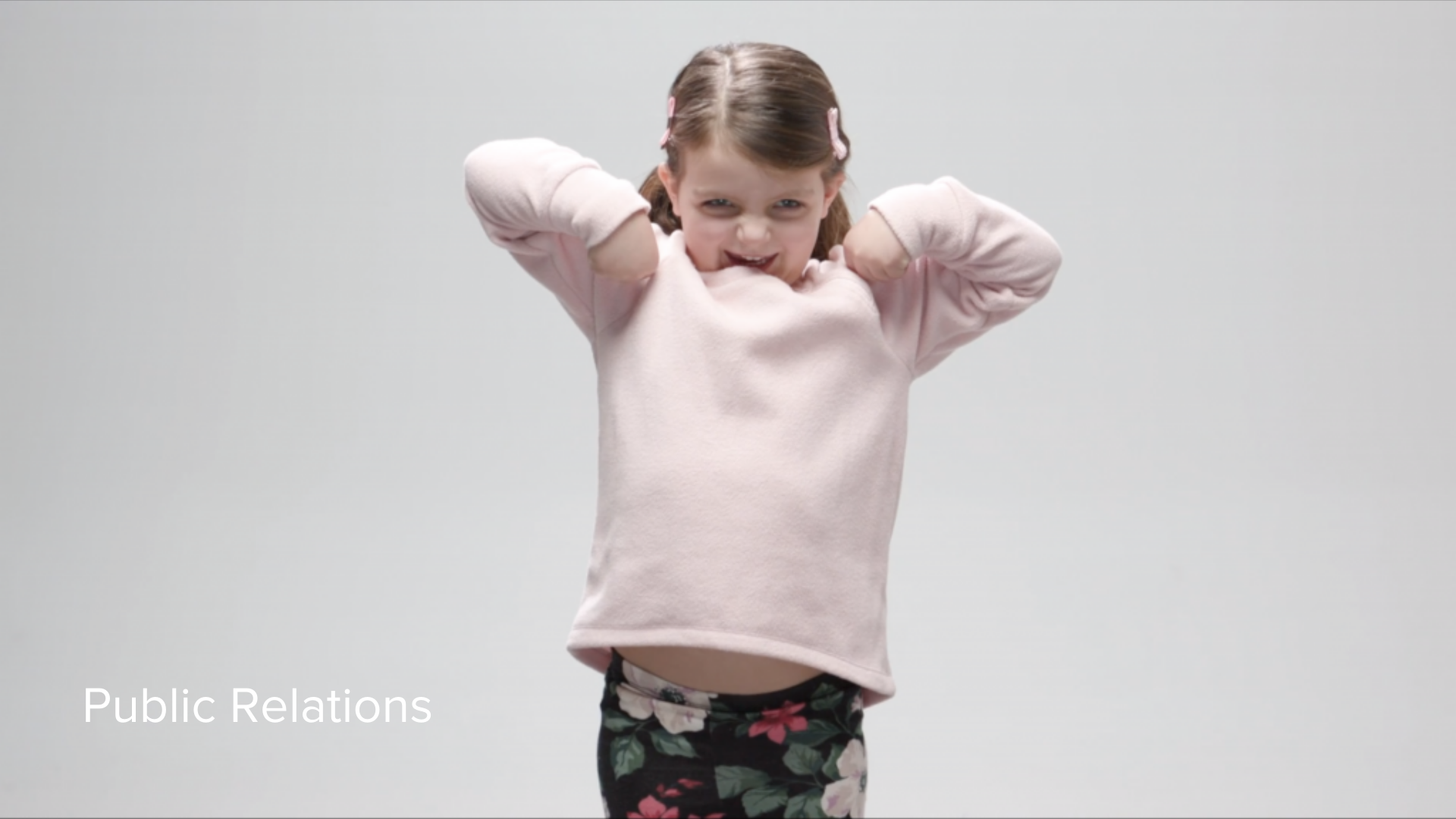 young girl with pink sweater