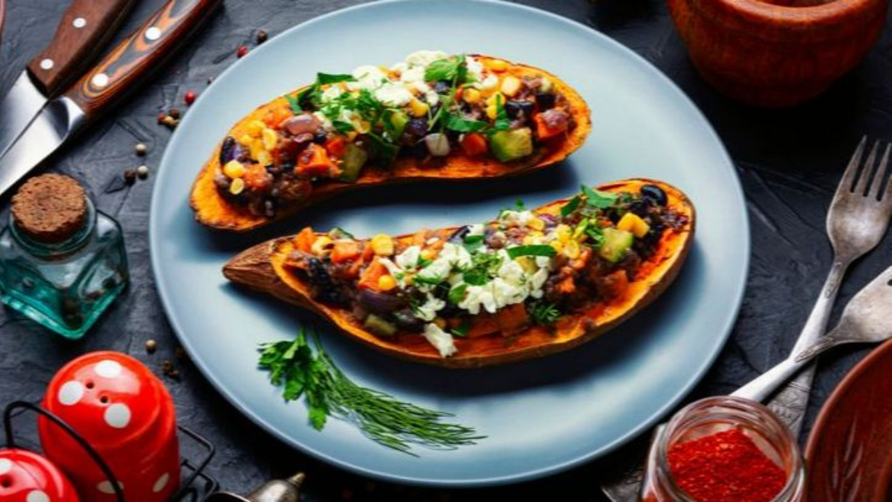 Sweet potatoes stuffed with black beans, veggies, guacamole