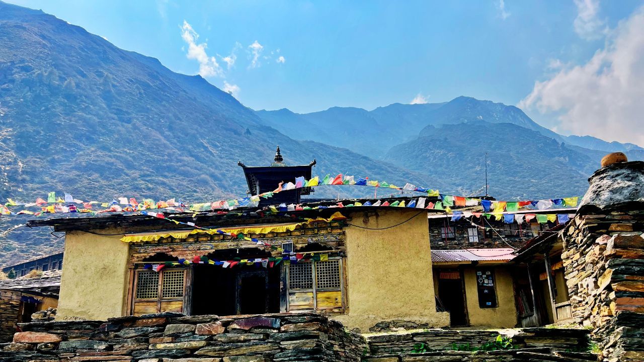 Mu Monastery in Tsum Valley, Nepal, at high altitude with mountains in the background