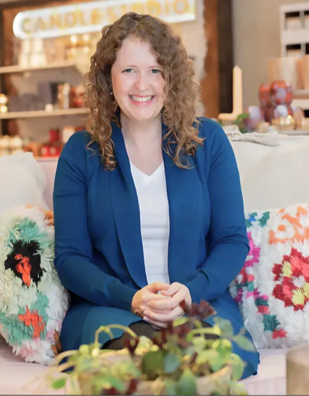 Kate Hatherell, founder of Interior Designers Hub, smiling in a modern interior setting