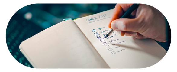 Person looking thoughtfully at notes or a list