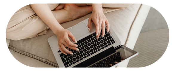 Person typing on a laptop with focused expression