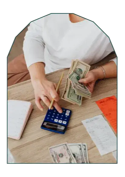 Person reviewing a budget or financial documents at home