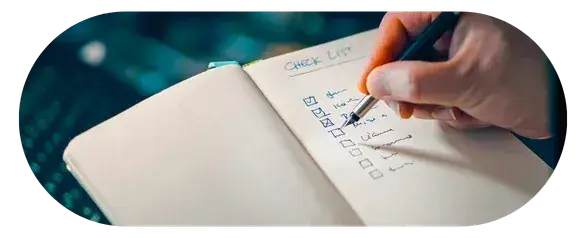 Person looking thoughtfully at notes or a list