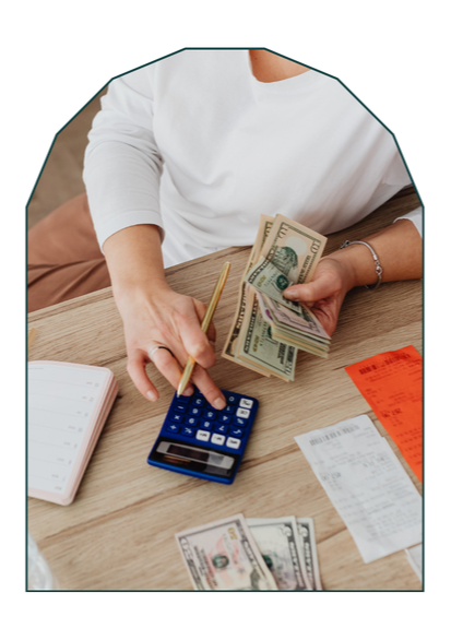 Person reviewing a budget or financial documents at home