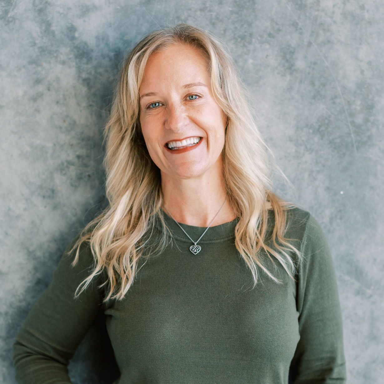 A warm and welcoming presence—Ali Webb, certified yoga therapist specializing in anxiety, trauma recovery, and nervous system regulation