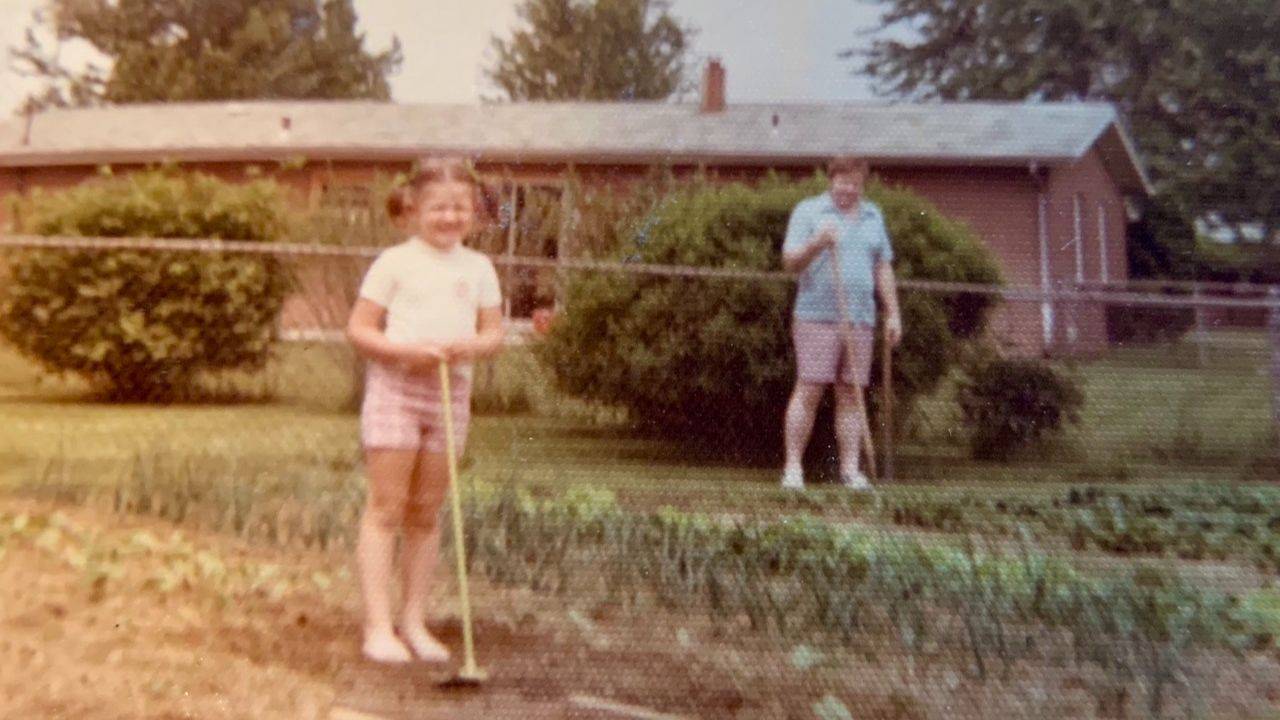 Me and my Dad working in the garden in the 1970's.
