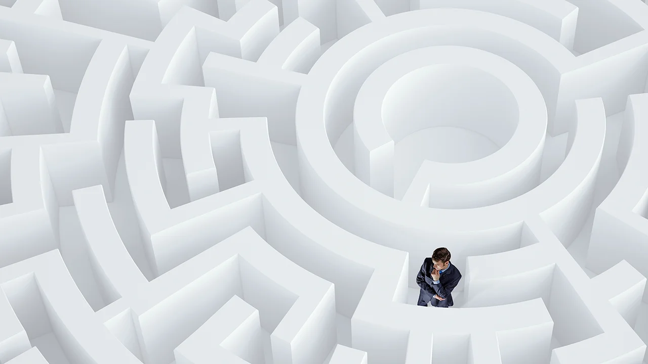 Business Man Stuck in a White Maze