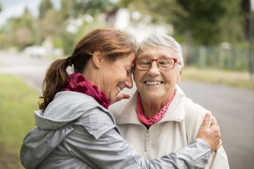 Adult child and aging parent in conversation