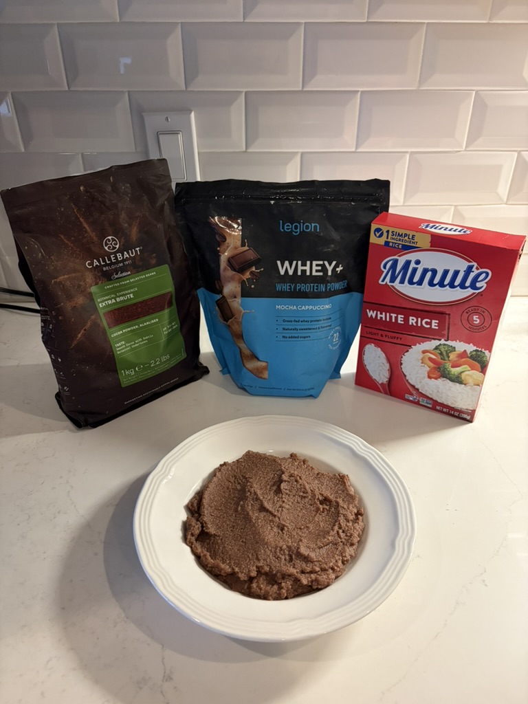Cream of rice, Legion Whey+ mocha cappuccino and cocoa powder with a bowl of chocolate cream of rice