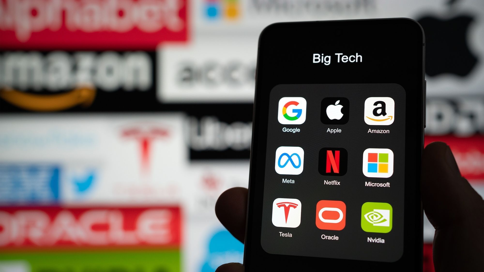 Phone displaying Big Tech company logos.