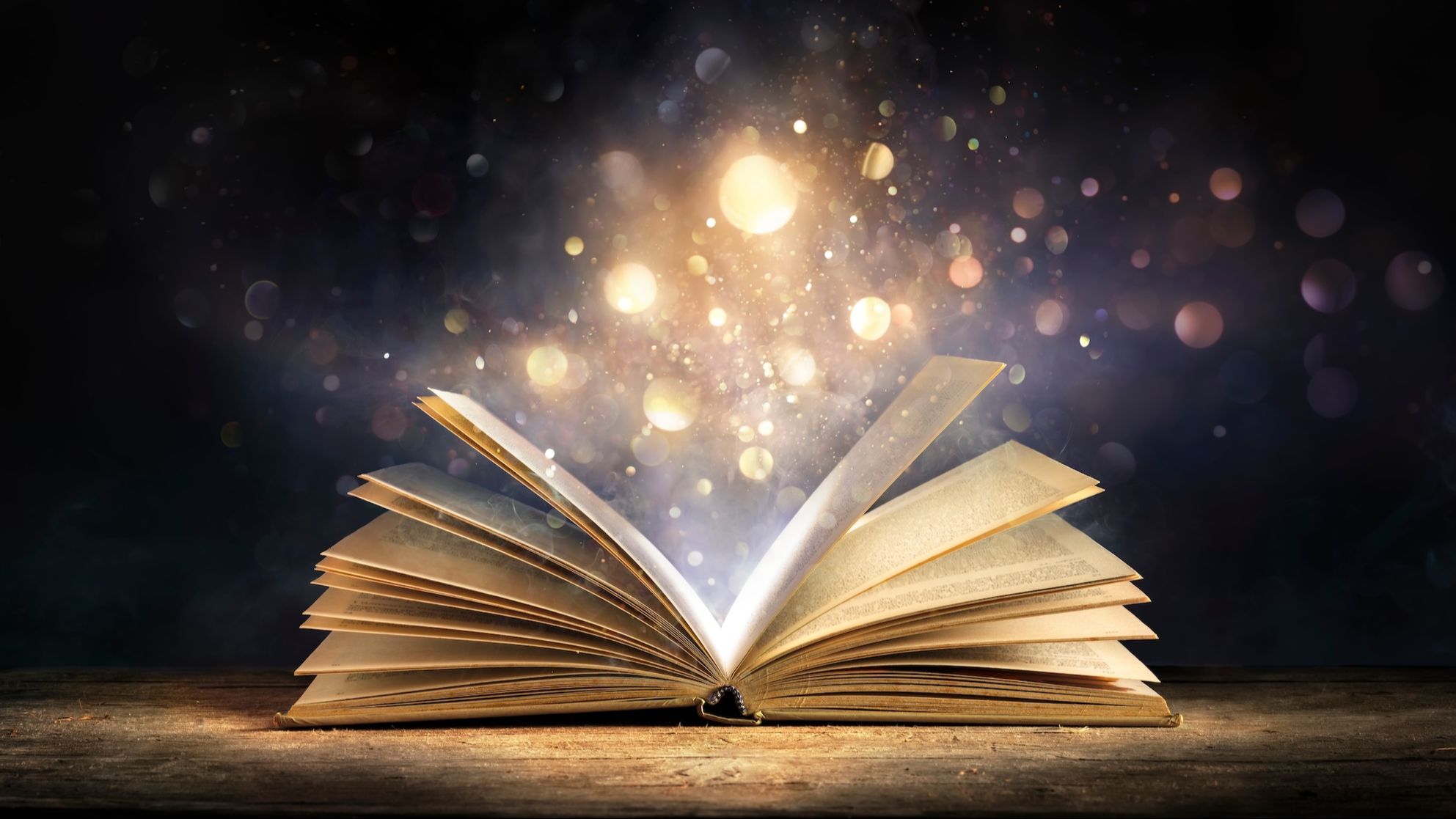 Open book with glowing pages