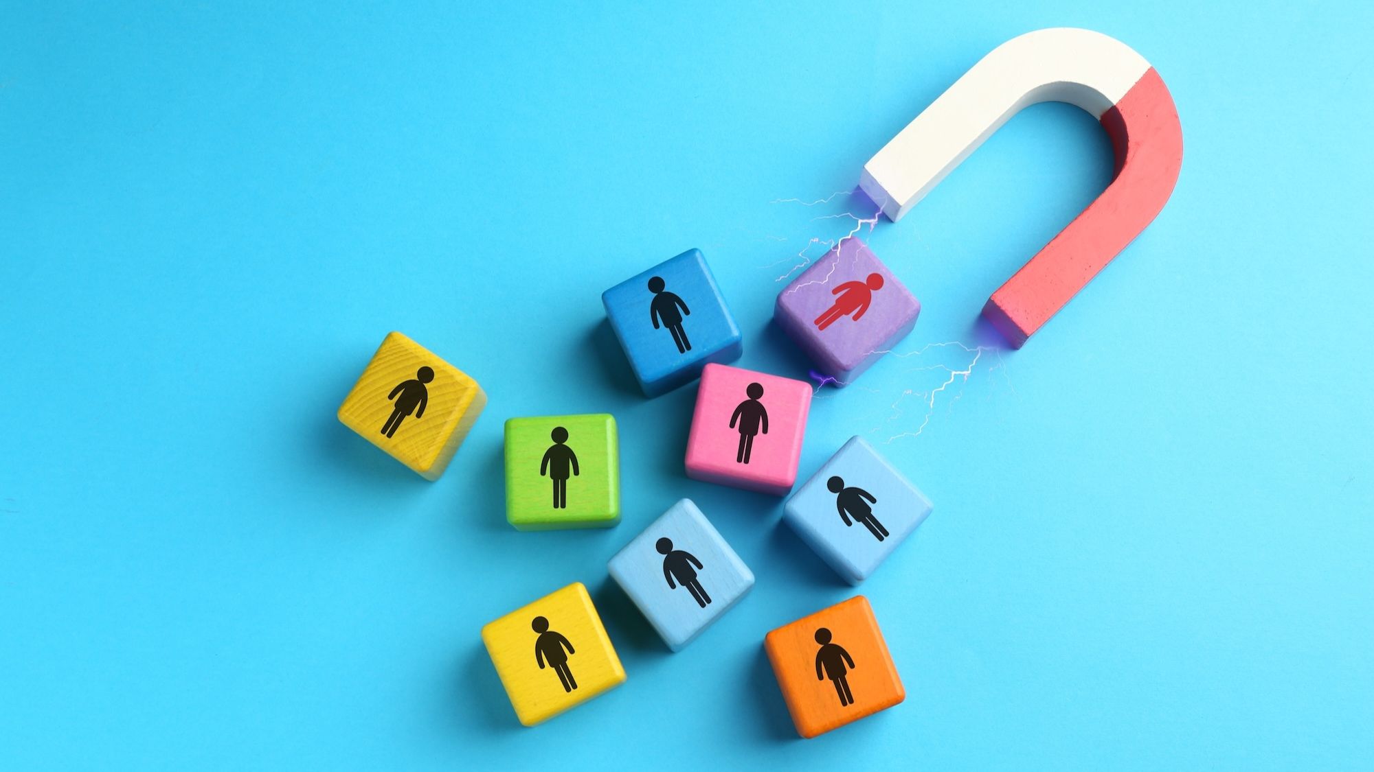 Magnet attracting colorful people