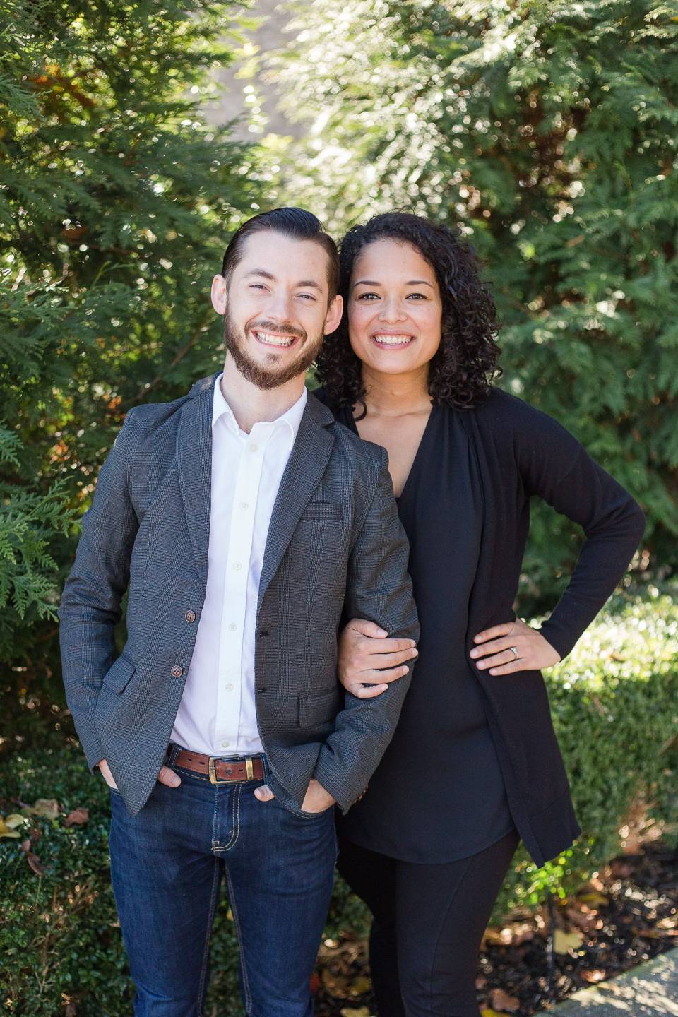 Drs. Nathan and Rebecca Warren laughing together outside