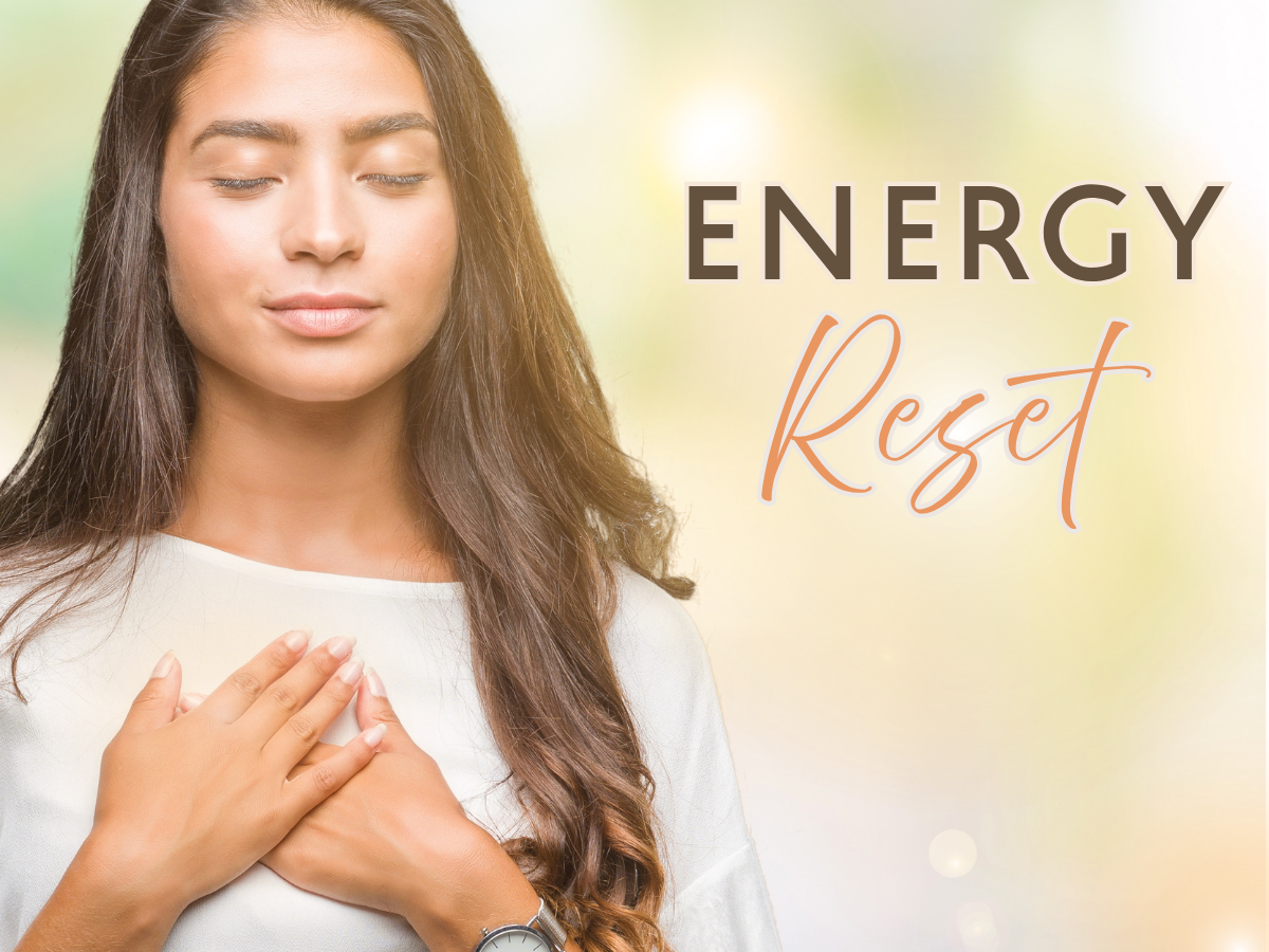 Image of a young woman with hands on her heart and eyes closed 