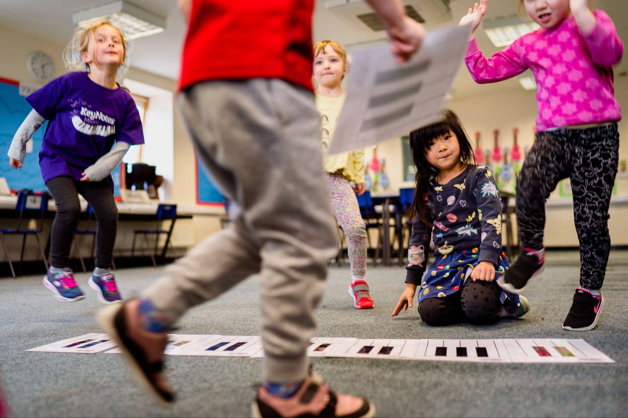 Children collaborating in a KeyNotes group piano class