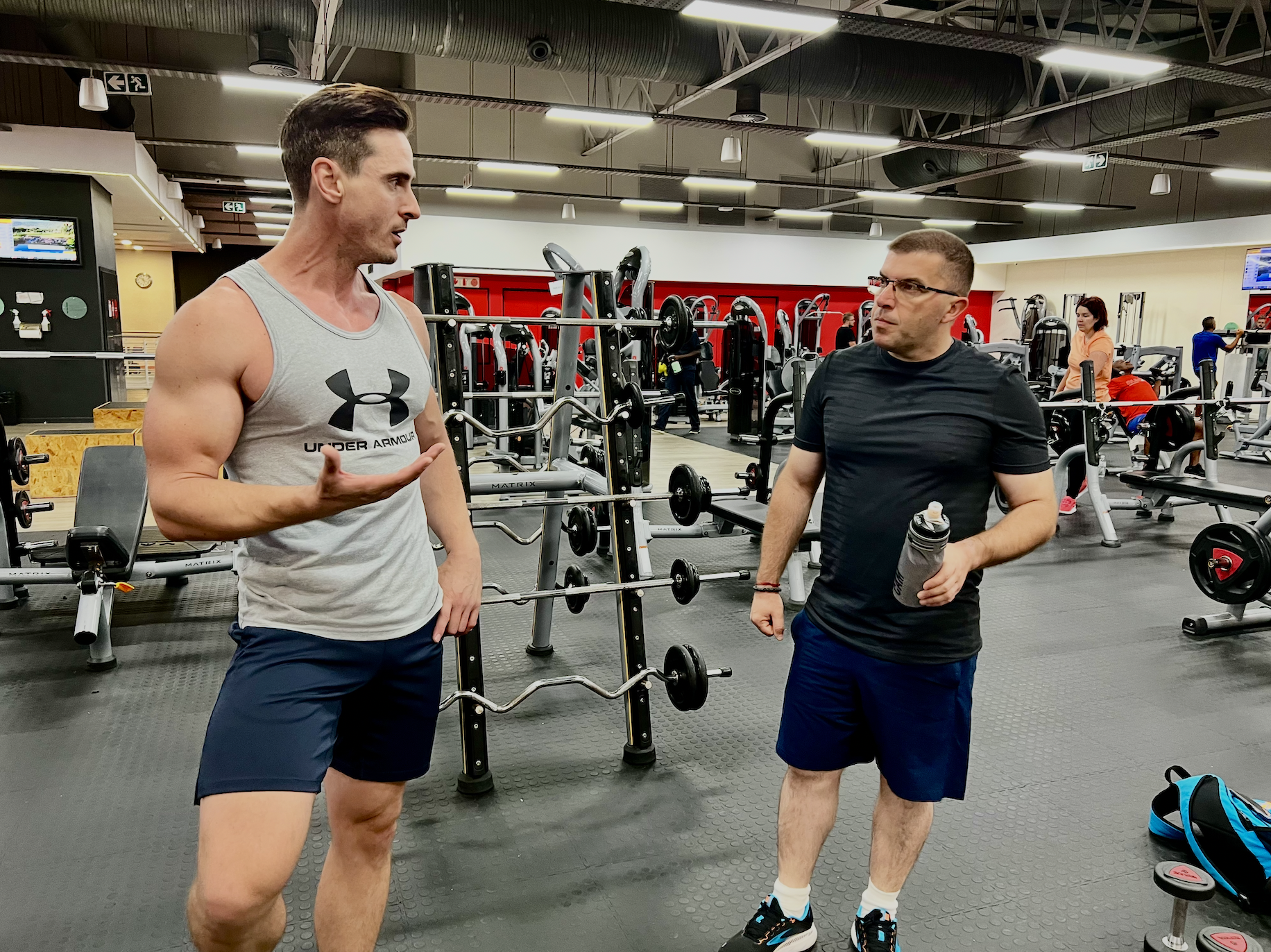 Jacque Visagie coaching Bobby Petkov in the gym