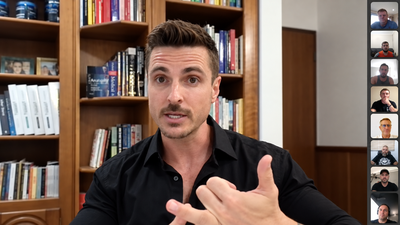 Jacque Visagie coaching eight men together in a warm home library setting