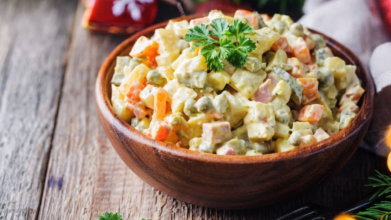 A bowl of Russian Olivier Salad | Differences between Russian Salad (Salad Olivier), Spanish Ensaladilla Rusa and Venezuelan Ensalada de Gallina