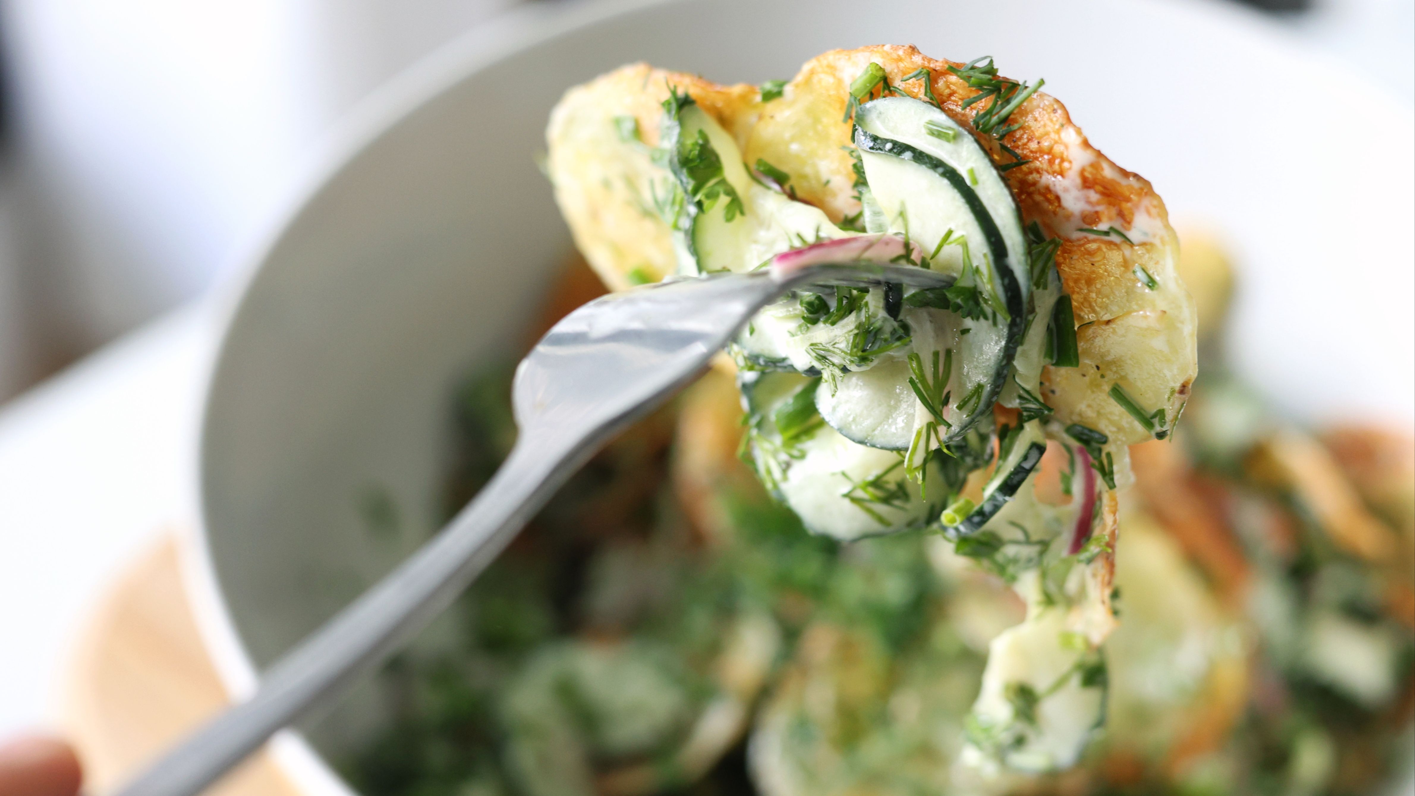 Vegan potato salad with crispy potato chips and a crunchy pickled slaw