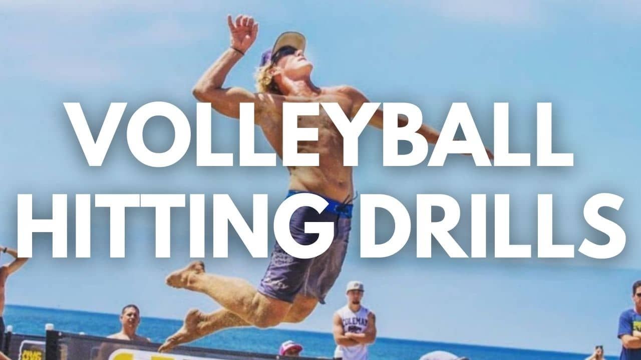 Beach volleyball player spiking during a training drill on the sand